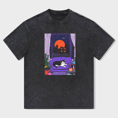 Short Sleeve Black T-Shirt with Cozy Cat on Purple Couch Print for Casual Wear